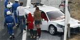 <span style='font-family: Arial; font-size: 15px; color: White;'>Den hvide Ferrari Daytona blev kendt i tv-serien Miami-patruljen, der var stor i 1980'erne.</span> <span style='font-family: Arial; font-weight: normal; font-size: 15px; color: #999999;'>Foto: AP Photo/Kyodo News / POLFOTO</span>