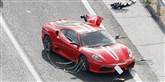 <span style='font-family: Arial; font-size: 15px; color: White;'>Her en nyere Ferrari-model, der slap billigere fra uheldet.</span> <span style='font-family: Arial; font-weight: normal; font-size: 15px; color: #999999;'>Foto: AP Photo/Kyodo News / POLFOTO</span>