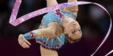 <span style='font-family: Arial; font-size: 15px; color: White;'>Der er masser af glimmer, palietter og tyk sminke, når gymnasterne går på måtten under OL.</span> <span style='font-family: Arial; font-weight: normal; font-size: 15px; color: #999999;'>Foto: AP/Gregory Bull / POLFOTO</span>