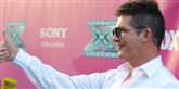 <span style='font-family: Arial; font-size: 15px; color: White;'>Ifølge meddommer i X-Factor Simon Cowell er Britney en "ond" dommer, men hun mener ikke selv, at det er et problem.</span> <span style='font-family: Arial; font-weight: normal; font-size: 15px; color: #999999;'>Foto: Jordan Strauss/Invision/AP / POLFOTO</span>
