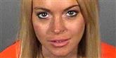 <span style='font-family: Arial; font-size: 15px; color: White;'>Frk. Lohan har udover at gå til fest uden trusser også afsonet en fængselsstraf for at køre spirituskørsel. Her ses hendes såkaldte 'Mug shot' fra fængslet.</span> <span style='font-family: Arial; font-weight: normal; font-size: 15px; color: #999999;'>Foto: Scanpix, AFP</span>