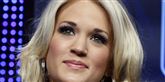 <span style='font-family: Arial; font-size: 15px; color: White;'>Carrie Underwood stoppede sin bil og trak ind til siden, da hun opdagede, at der lå en såret hundehvalp i vejkanten, der blødte og haltede. Hun reddede hunden, tog den med til dyrelægen og skrev efterfølgende på sin blog: "Mit gæt er, at hundene blev smidt ud af en bil af deres ejere på motorvejen".</span> <span style='font-family: Arial; font-weight: normal; font-size: 15px; color: #999999;'>Foto: Scanpix, Reuters, BRIAN SNYDER</span>