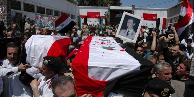 Kina og Rusland har nedlagt veto mod en resolution, der støtter Den Arabiske Ligas krav om, at Syriens præsident Bashar al-Assad træder tilbage.