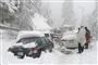 biler sidder fast i sneen