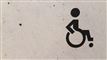 Et tegn med kørestol på en væg