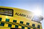 tekst på ambulance siger alarm 112
