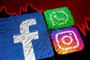 Ikonerne for facebook og instagram og whatsapp på en smadret skærm