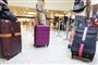 En masse kufferter i en lufthavn