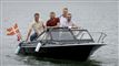 Fire mænd i en lille speedbåd