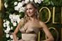 kvinde - værtinden ved golden globe oi flot dres