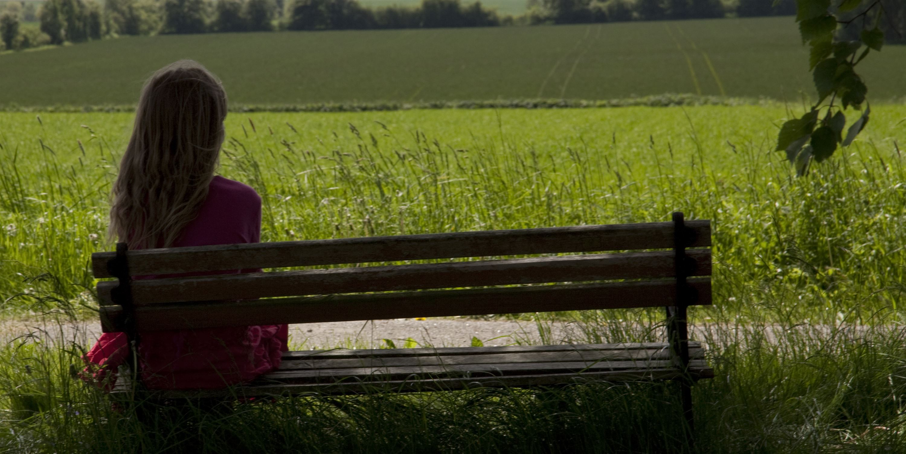 Sad Woman Sitting On Bench Image